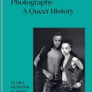 Cover of the book, featuring a black and white photo of two figures in leather outfits.